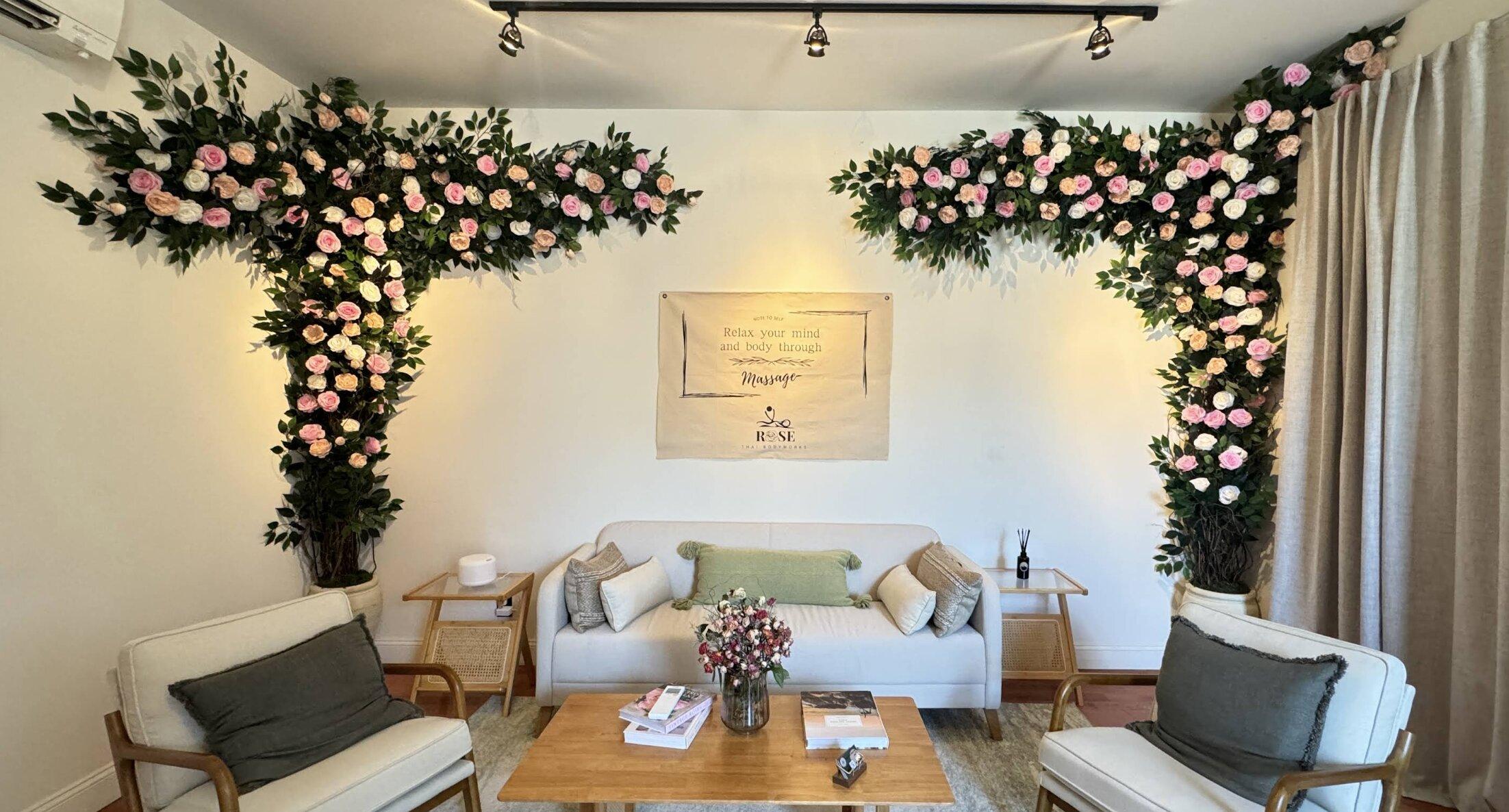 Reception lounge with floral wall arrangements