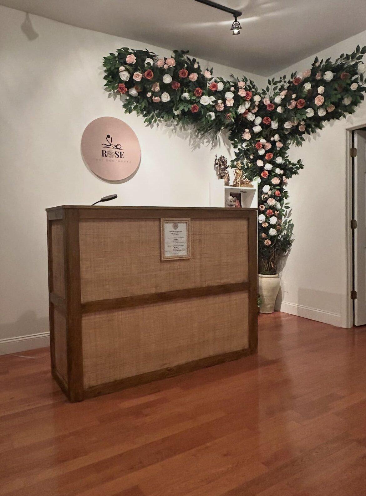 Reception desk with cascading flower arrangement