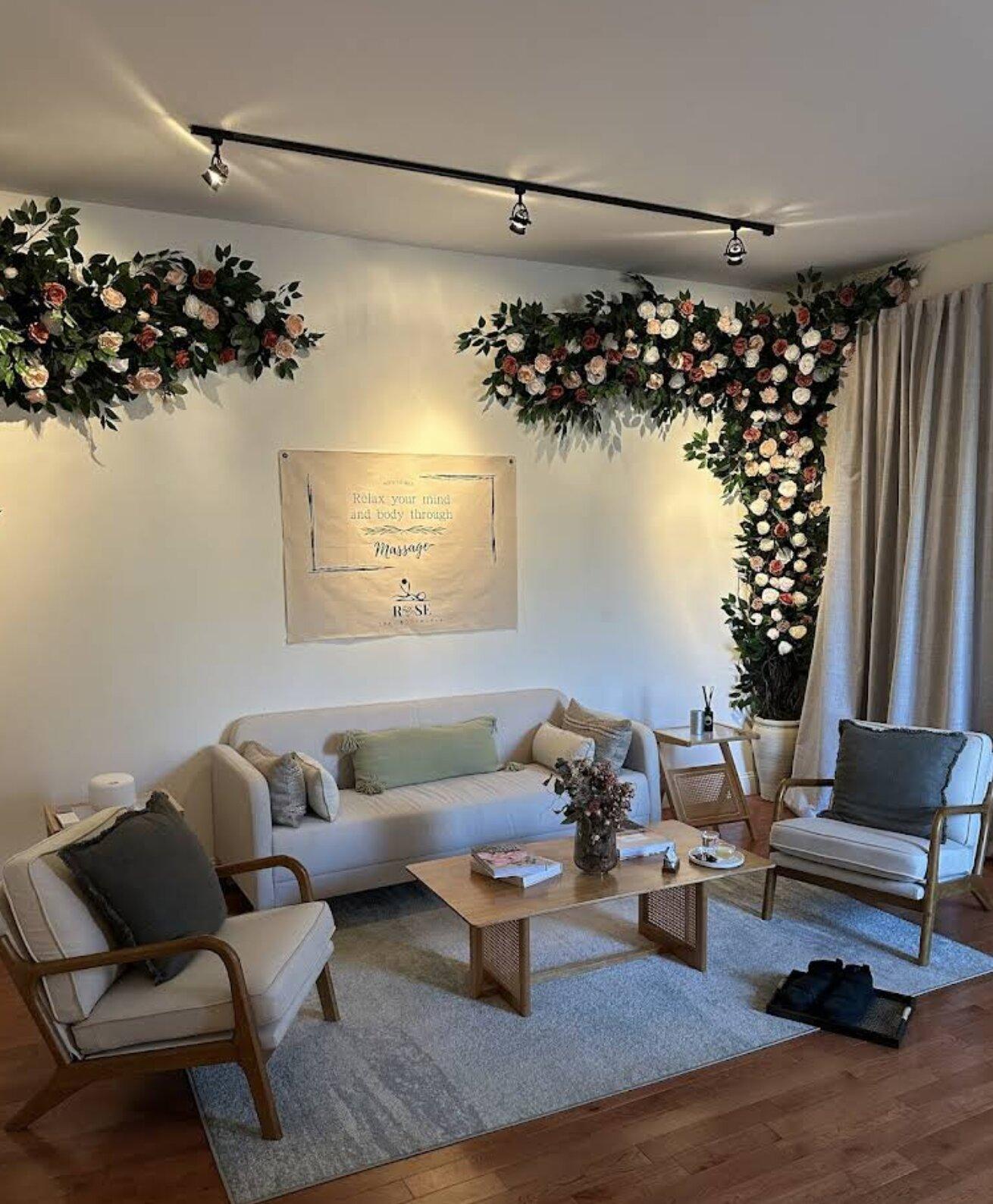 Waiting area with couch and floral decor